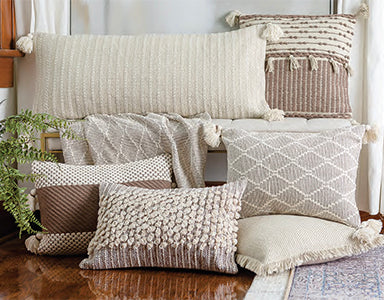 Fall pillow collection in earth tone patterns and hand woven textures