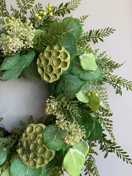 Close look at foliage of Eucalyptus, Fern and Lotus Pod Wreath, 26in.
