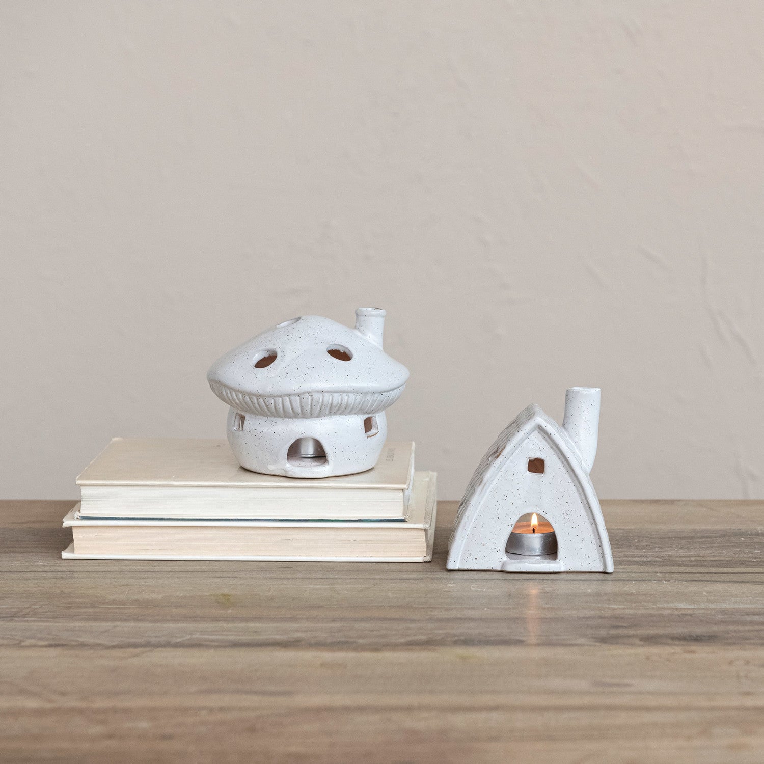 Mushrrom shaped house and Woodland cabin shaped stoneware tealight or incence holders in matte white glaze with brown speckles.
