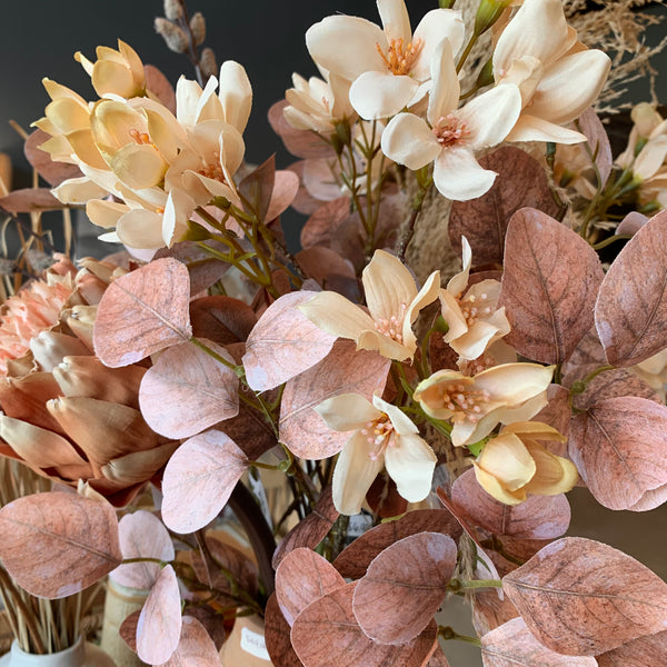Terracotta Blush Smoketree Leaf Spray, with round light terracotta and blush toned leaves on long green and brown stems 25.5in,H shown with Terracotta Blush artichoke stem and Vanilla Field Flower Spray blooms.