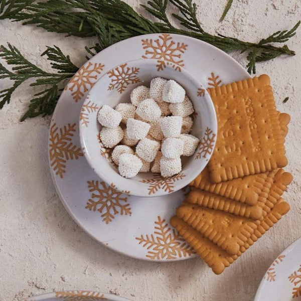 Pretty Snowflake Motif White Stoneware Dessert Plate, 6in.Dia. with tan raw ceramic wax relief snowflake design on round white stoneware plate perfect for holiday treats on your cookie or hotchocolate bar.