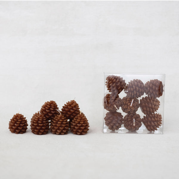 Set of 9 Petite Wide brown Pinecone tealight candles in clear plastic box