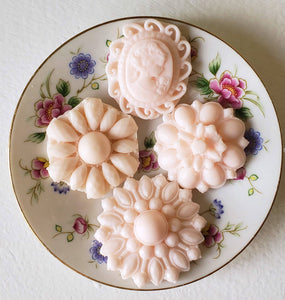 These hand-poured soft pink soap bathing brooches are boxed in set of 4 unique brooches, including a classic cameo. Fragrance: Cherry blossom.