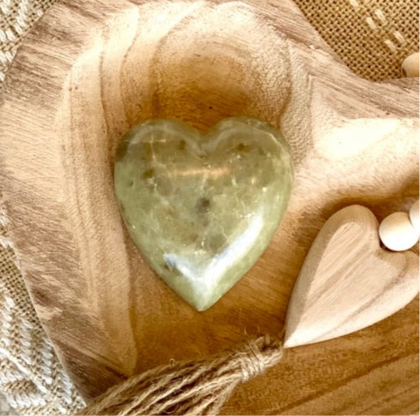 carved soapstone heart is shades of green. 2 3/4" x 2 3/4"